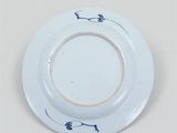 an image of a white plate with a blue design on it