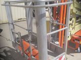 a picture of a forklift parked in front of a building
