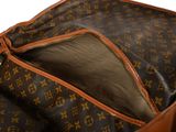 the inside of a louis vuitton bag with a zipper open