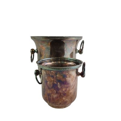 a large metal vase with handles on a white background