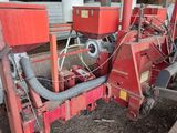a red machine that is sitting inside of a building