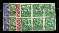 a green, purple and red stamp on a black background