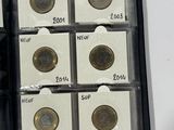 a box of coins that are sitting on top of a table