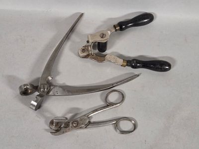 a pair of scissors and a pair of shears on a table