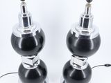 pair of black and chrome table lamps with glass bases