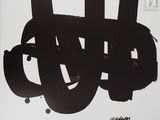 a picture of a black and white painting on a white wall