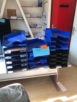 a lot of blue bags on a shelf in a room