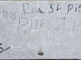 graffiti on the sidewalk of a building with a sign that says, be kind of nice, protect people