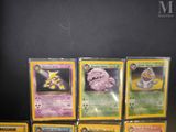 a lot of pokemon cards that are on the table