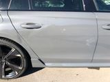 a silver car parked on the side of the road
