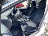 the interior of a car with two seats and a steering wheel
