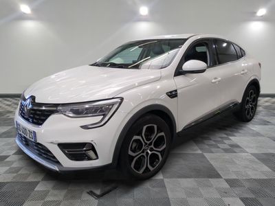 a white suv parked in a room with a checkered floor