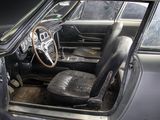 a black car with a leather seat and steering wheel