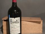 a bottle of wine that is sitting in a wooden box