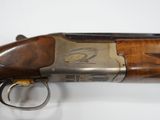 a close up of a shotgun on a white surface
