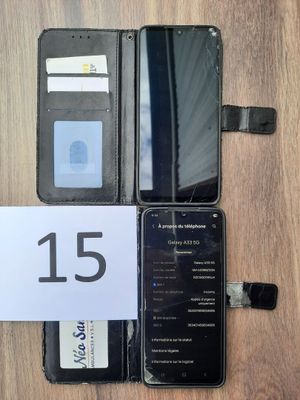 an image of a cell phone sitting on top of a table next to a wallet