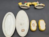several pieces of porcelain are laid out on a table