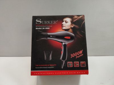 packaging of a hair dryer sitting on top of a white table