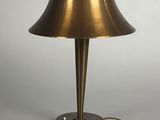 an image of a brass table lamp on a white background