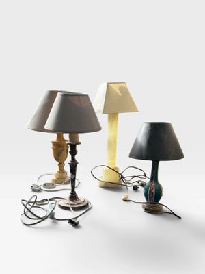 three lamps that are sitting next to each other on a table
