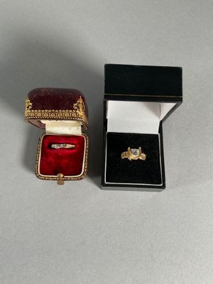 a small box with a ring inside of it on a table