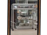 a large mirror with a black frame on the wall