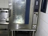 a commercial oven in a commercial kitchen with tile flooring