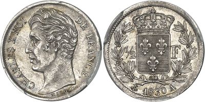 a silver coin with a crown on top of it
