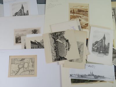 a lot of drawings and pictures on the table