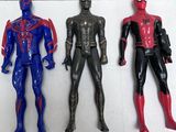 three spider - man action figures lined up on a shelf