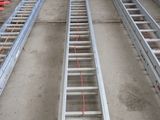 two ladders that are attached to the side of a building