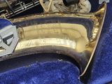a saxophone that is sitting in a blue case