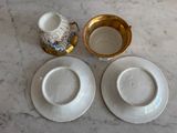 two plates and a cup sitting on a table