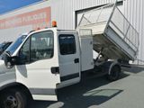 a white truck that is parked in front of a building