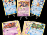 Plusieurs cartes Pokémon sont alignées sur un fond noir.