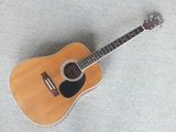 a close up of a guitar laying on the ground