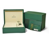 a close up of a box with a watch inside of it