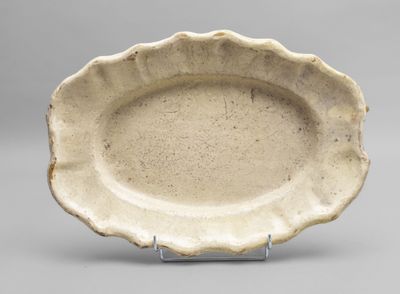 bowl with scalloped rim and raised rim