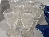 a lot of glasses and a bowl on the table