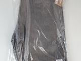 the pants are wrapped in plastic and ready to be worn