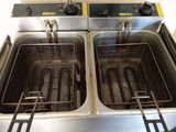 two deep fryers that are sitting in the kitchen