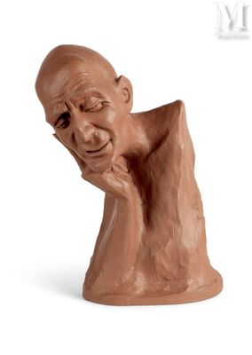 statue of a man with his chin resting on his hand