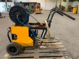 a machine that is sitting on a pallet in a warehouse