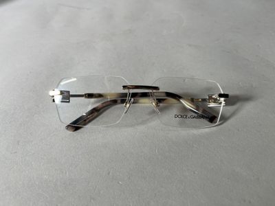 a pair of glasses that are laying on a table