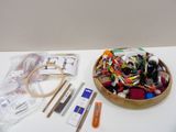 a wooden bowl filled with assorted items on a table
