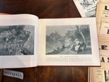 an open book on a table with pictures of people