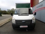 a white van that is parked in front of a building