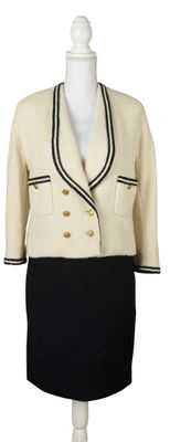 an image of a woman ' s dress and jacket on a mannequin