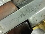 a close up of a gun that is on a table