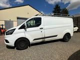 a white van parked in front of a building